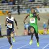Ricardo Makyn/Staff Photographer 
Dejour Russell of Clabar winner of the Boys Class 3,100 Meters moving away from team mate Tyreke Wilson and at left Chislon Gordon of Jamaica College ion  day 4 at Champs 2014