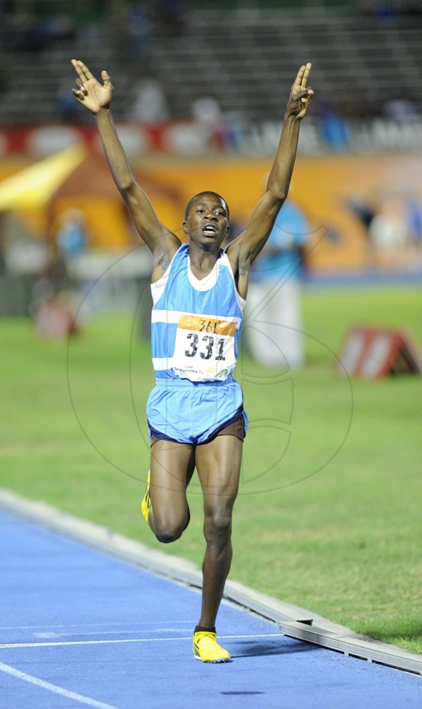 Ricardo Makyn/Staff Photographer 
Detroy Stewart of Edwin Allen winning the Boys class 3 1500 meters on from day 4 at Champs 2014