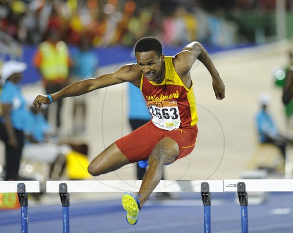 Ricardo Makyn/Staff Photographer 
Jaheel Hyde shattering the Boys open Record for the 400 Meter Hurdles on Day 4 of Champs 2014