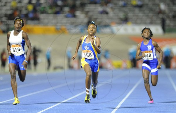 Ricardo Makyn/Staff Photographer 
Kiara Grant  of Convent of Mercy sprinting away to winthe Girls Class4,100 Meters ahead of hydels Ashanti Moore and Immaculates Shaunelle Wallace on  day 4 at Champs 2014