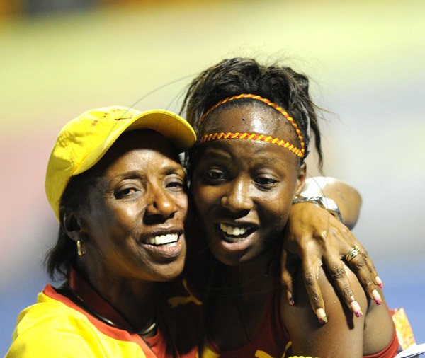 Ricardo Makyn/Staff Photographer 
Charmaine Helps with Her Daughter Shauna Helps who won the Girls Class 2,100 Meters on day 4 at Champs 2014