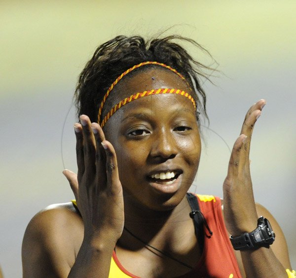 Ricardo Makyn/Staff Photographer 
 Shauna Helps reacts after  won the Girls Class 2,100 Meters on day 4 at Champs 2014