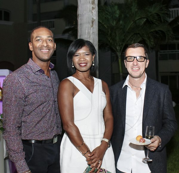 Ashley Anguin<\n>From left: Hugh Logan, Natasha James and Giorgio Rusconi, are all smiles for our lens as they await the gastronomic fare at Iberostar Grand in Montego Bay.<\n> *** Local Caption *** @Normal:From left: Hugh Logan, Natasha James and Giorgio Rusconi are all smiles for our lens as they await the gastronomic fare at Iberostar Grand in Montego Bay.