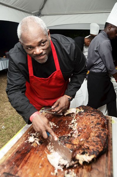 Rudolph Brown/Photographer
Chef Gari Ferguson from G's BBQ show his jerk pork at the Chefs on Show event at 15 Paddington Terrace in Kingston on Wednesday, June 13-2012