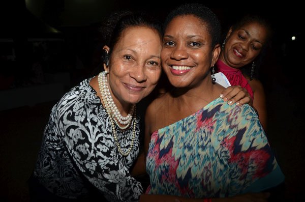 Rudolph Brown/Photographer
Chef Lorraine Fung, (left) pose with Joan Forrest Henry, (right) Divisional Sales and Marketing Manager of Best Dres Chicken and Sheron Gilzean at back at the Chefs on Show event at 15 Paddington Terrace in Kingston on Wednesday, June 13-2012