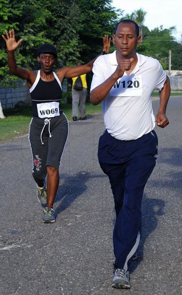 Colin Hamilton/Freelance Photographer
The Chest Hospital 5K run in aid of the High Dependency Unit to boost awareness of asthma in recognition of World Asthma Day which was celebrated on May 1, 2012..
The run started at the hospital, then up Old Hope Road through Hope Pastures, down Charlemont Ave and finished back at the hospital.

Minister Andre Hylton struts ahead of compitition.