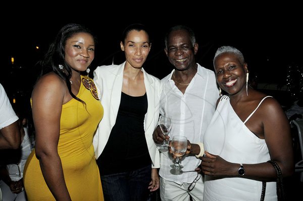 Winston Sill / Freelance Photogra
Chester Francis Jackson Birthday Party, held at Spanish Court Hotel, St. Lucia Avenue, New Kingston on Sunday  night August 26, 2012. Here are ----???? (left); Romae Gordon (second left); James Samuels (second right); and  Dr. Carolyn Cooper (right).