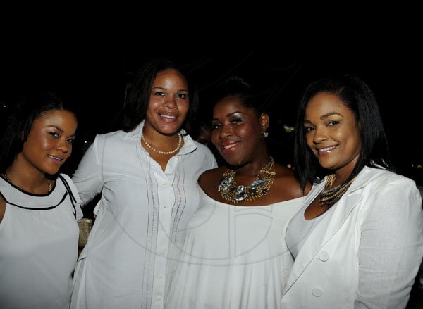 Winston Sill / Freelance Photogra
Chester Francis Jackson Birthday Party, held at Spanish Court Hotel, St. Lucia Avenue, New Kingston on Sunday  night August 26, 2012. Here are Deidre Francis (left); Allison Shaw (second left); Seya Wilson (second right); and Dr. Jody Jarrett (right).