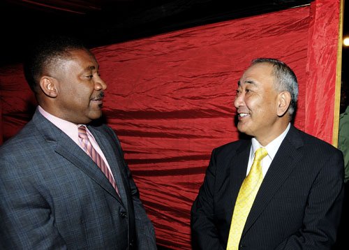 Winston Sill / Freelance Photographer
The Chairman of Jamaica Public Service Company (JPS)  Hisatsugu Hirai host Chinese New Year's Reception, held at Plymouth Close, St. Andrew on Tuesday night January 24, 2012. Here are Minister Phillip Paulwell (left); and Hirai (right).