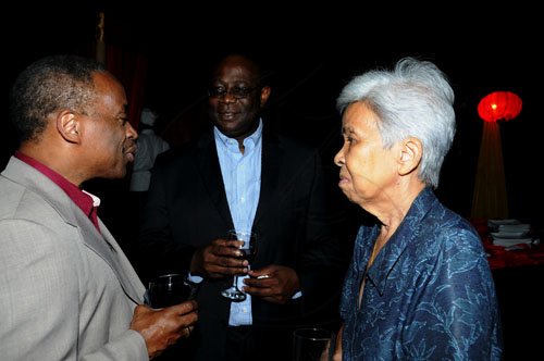 Winston Sill / Freelance Photographer
The Chairman of Jamaica Public Service Company (JPS)  Hisatsugu Hirai host Chinese New Year's Reception, held at Plymouth Close, St. Andrew on Tuesday night January 24, 2012. Here are Milton Samuda (left); Vitus Evans (centre); and Beverley Lopez (right).