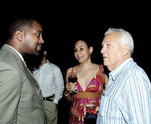 Winston Sill / Freelance Photographer
The Chairman of Jamaica Public Service Company (JPS)  Hisatsugu Hirai host Chinese New Year's Reception, held at Plymouth Close, St. Andrew on Tuesday night January 24, 2012. Here are Minister Julian Robinson (left); Lisa Johnston (centre); and Charles Johnston (right).