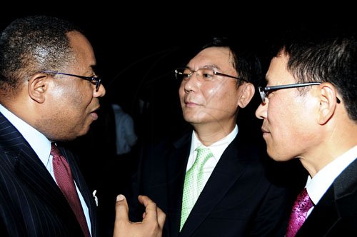 Winston Sill / Freelance Photographer
The Chairman of Jamaica Public Service Company (JPS)  Hisatsugu Hirai host Chinese New Year's Reception, held at Plymouth Close, St. Andrew on Tuesday night January 24, 2012. Here are Minister Anthony Hylton (left); Korean charge d'affaires Kimo Lim  (centre); and Sang Kie Cho (right) Director, JPS.