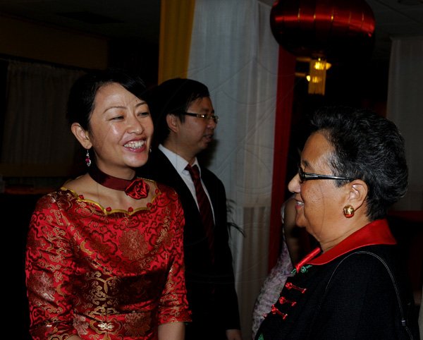Winston Sill / Freelance Photographer
Chinese Ambassador Qingdian Zheng host China National Day Reception, held at the Jamaica Pegasus Hotel, New Kingston on Wednesday night September 26, 2012. Here are Lei Liu (left); and Fay Pickersgill (right).