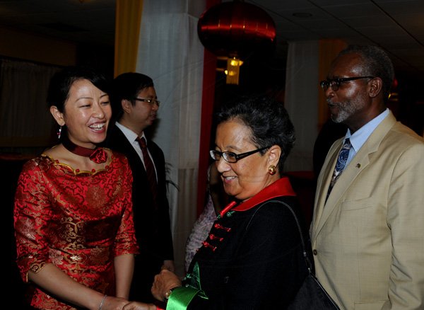 Winston Sill / Freelance Photographer
Chinese Ambassador Qingdian Zheng host China National Day Reception, held at the Jamaica Pegasus Hotel, New Kingston on Wednesday night September 26, 2012.  Here are Lei Liu (left);  Fay Pickersgill (centre); and Dr. Raymong Brown (right).
