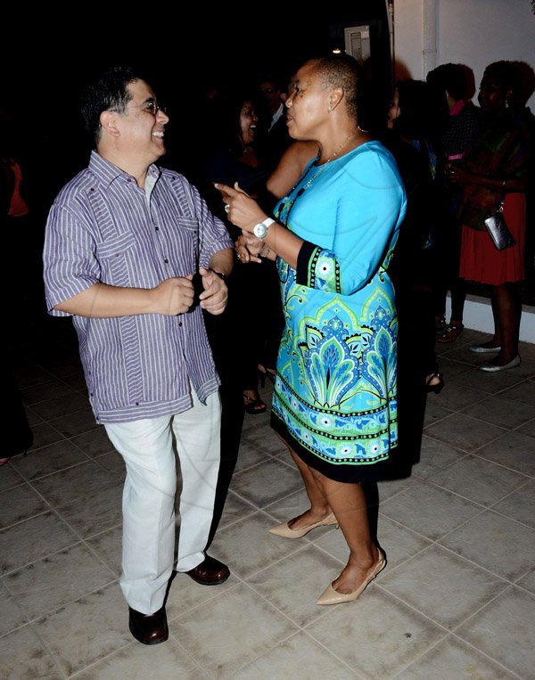 Winston Sill/Freelance Photographer
Latin American Women's Club (LAWC) host  Cinco de Mayo  Mexican Celebration Party, held at Cherry Garden Avenue on Saturday night May 3, 2014. Here are Gerardo Lazano (left), Mexican Ambassador shows Mathu Joyini (right), South African High Commissioner how the Mexicans do it on the dancefloor during cinco de MAyo.  on the dance floor.