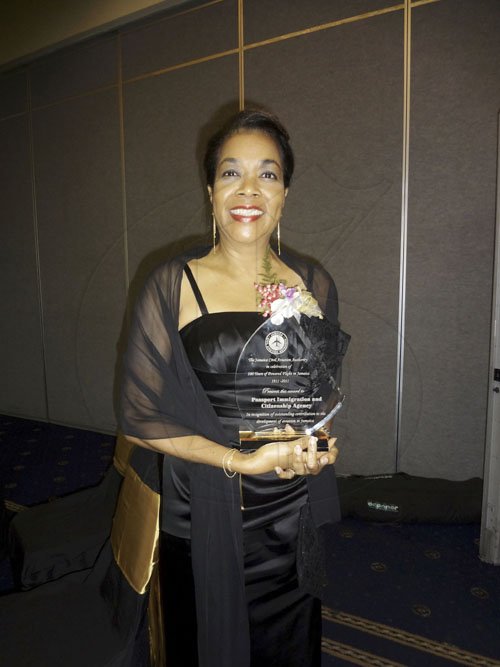 Barbara Ellington/Lifestyle Editor
Jennifer McDonald, chief executive officer of the Passport, Immigration and Citizenship Authority, poses with the award from the Jamaica Civil Aviation Authority.


********************************************************************* Awards Dinner on Saturday December 10, 2011 at the Pegasus Hotel.