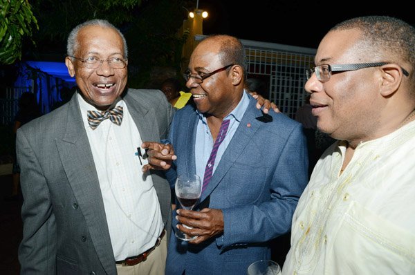 Rudolph Brown/Photographer
Professor Winston Davis, (left) share a joke with Edmund Bartlett, (centre) and Anthony Hylton, Minister of Industry, Investment and Commerce at the JCCUL cocktail reception in honour of the existing stakeholders in the Jamaica Credit Union E-Payment Services (JCUES) its new mobile payment system at 9 Rosemarie Drive in St. Andrew on Friday, August 16, 2013