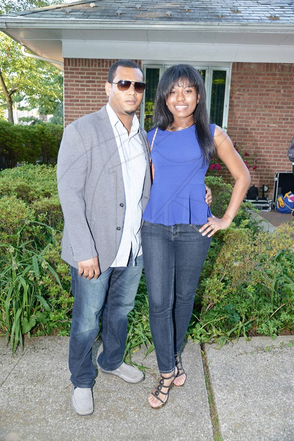 Gladstone Taylor / Photographer

Children of Jamaica Outreach (COJO) charity event held in queens new york on saturday the 21st 2014 consisting of a garden party, Fashion Show, Raffle and an Auction *** Local Caption *** Gladstone Taylor / Photographer
Paul Myrie and Kerisa Harriott paused for a photo op as they made their way into the backyard venue last Saturday.