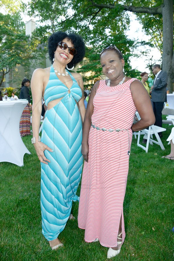 Gladstone Taylor / Photographer

Children of Jamaica Outreach (COJO) charity event held in queens new york on saturday the 21st 2014 consisting of a garden party, Fashion Show, Raffle and an Auction *** Local Caption *** Gladstone Taylor / Photographer
We couldnt help but notice these two ladies as they strutted across the lawn as they mixed and mingled. They, Patricia Surgeon (left) and Winsome Dixon eagerly willfully obliged when we asked for a photo op.