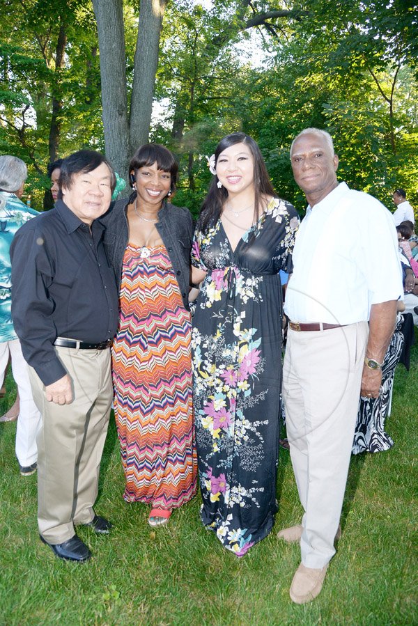 Gladstone Taylor / Photographer

Children of Jamaica Outreach (COJO) charity event held in queens new york on saturday the 21st 2014 consisting of a garden party, Fashion Show, Raffle and an Auction *** Local Caption *** Gladstone Taylor / Photographer
The evening's host Mr Dalbert Daley (right) joins (from left) Vincent Hosang, Ann-Marie Grant and Sabrina Hosang for a quick photo op.