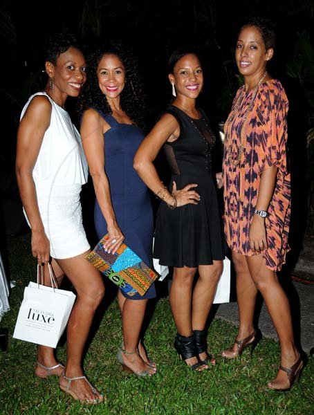 Winston Sill/Freelance Photographer
The Collection Moda fashion shopw, held at Hope Gardens, Old Hope Road on Wednesday night September 18, 2013. Here are Rochelle Cameron (left); Alicia Aleong (secondx left); Kyanne Jackson (second right); and Nadia Jervis (right).