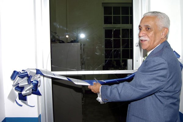 Tashieka Mair photo
Publication: Daily Gleaner

Minister of National security, Colonel Trevor Macmillan, cuts the ribbon to officially open the administrative office of the newly renovated Cambridge court and police station in Cambridge, St James.