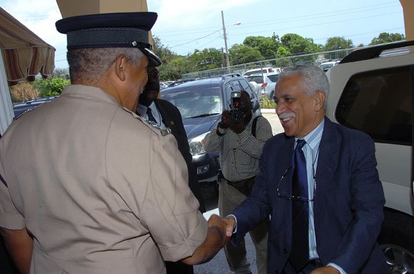 Rudolph Brown/Chief Photographer
Commissioner of Police Rear Admiral Hardley Lewin  greets Trevor MacMillan, (right)  Minister of National Security at a meeting with the police officers at the Police Officer Club in Kingston on Tuesday, May 13-2008