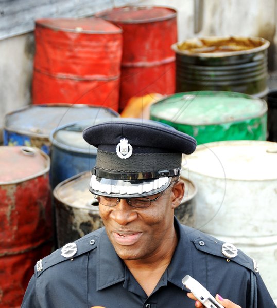 Ricardo Makyn/Staff Photographer.
Acting Commissioner of Police Owen Ellington leading operation in Greenwich Town on South Avenue to confiscate illegal Gas on Thursday 25.3.2010.