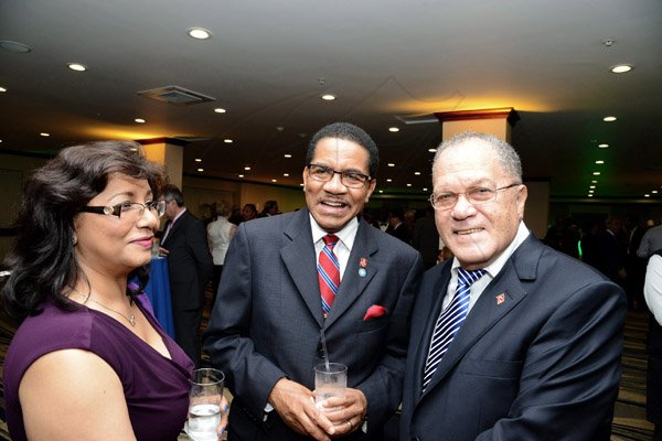 Winston Sill/ Freelance Photographer

Honorary Council to Guyana Indira Persaud, Dean Grantley Stephenson and The Honorable Arnold Foote  president of World Federation of Consuls pose for a photo op.