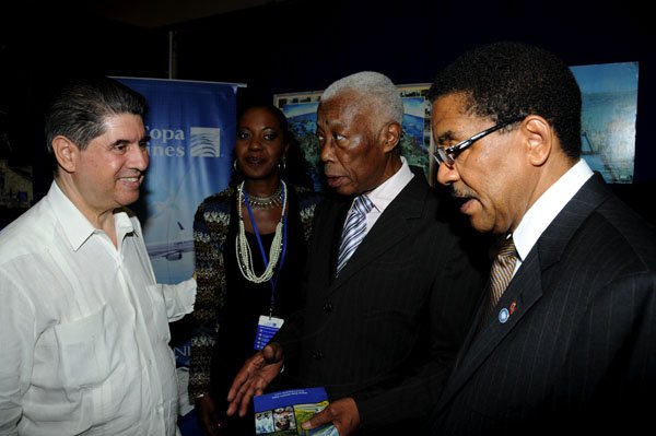 Winston Sill / Freelance Photographer
The Consular Corps of Jamaica annual International Trade Expo 2012 Opening Ceremony, held at the Jamaica Pegasus Hotel, New Kingston on Friday night October 5, 2012. Here are Jorge Constantino (left), Panamain Ambassador; Trudy Dixon (second left), Country Manager, Copa Airlines; Minister AJ Nicholson (second right); and Grantley Stephenson (right)
