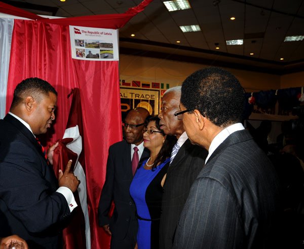 Winston Sill / Freelance Photographer
The Consular Corps of Jamaica annual International Trade Expo 2012 Opening Ceremony, held at the Jamaica Pegasus Hotel, New Kingston on Friday night October 5, 2012. Here are Robert Scott (left); Winston Bayley (second left); Indera Persaud (third right); Minister AJ Nicholson (second right); and Grantley Stephenson (right).