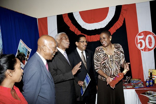 Winston Sill / Freelance Photographer
The Consular Corps of Jamaica annual International Trade Expo 2012 Opening Ceremony, held at the Jamaica Pegasus Hotel, New Kingston on Friday night October 5, 2012. Here are Erlene Kowlessar (left0; Winston Bayley (second left); Minister AJ Nicholson (centre); Grantley Stephenson (second right); and Dr. Iva Gloudon (right),Trinidad and Tobago High Commissioner inside the Trinidad Booth.