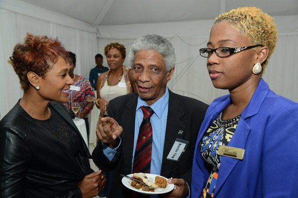 Rudolph Brown/Photographer
Professor Neville Ying chat with Simone Riley (right) and Alison Watson at the Wealth Magazine corporate mingle at the Spanish Court Hotel in New Kingston on Friday,January 31, 2014