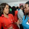 Rudolph Brown/Photographer
Georgia Lewis-Scott, (left)  of Youte Opportunities Unlimited chat with Onyka Barrett of Cuso at the Wealth Magazine corporate mingle at the Spanish Court Hotel in New Kingston on Friday, January 31, 2014
