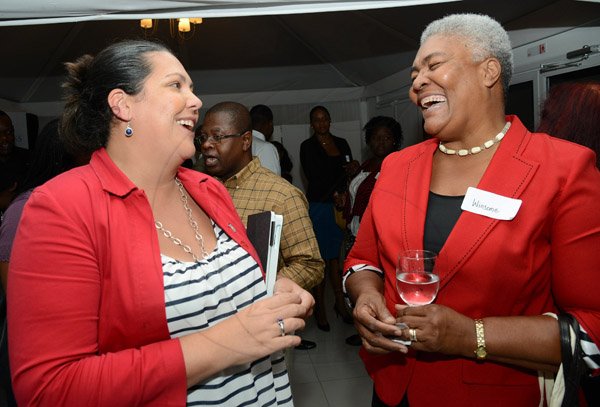 Rudolph Brown/Photographer
Business Desk
Winsome Wilkins Chairman of the Usain Bolt Foundation chat with JN Foundation’s General Manager, Saffrey Brown at the Wealth Magazine corporate mingle at the Spanish Court Hotel in New Kingston on Friday,January 31, 2014