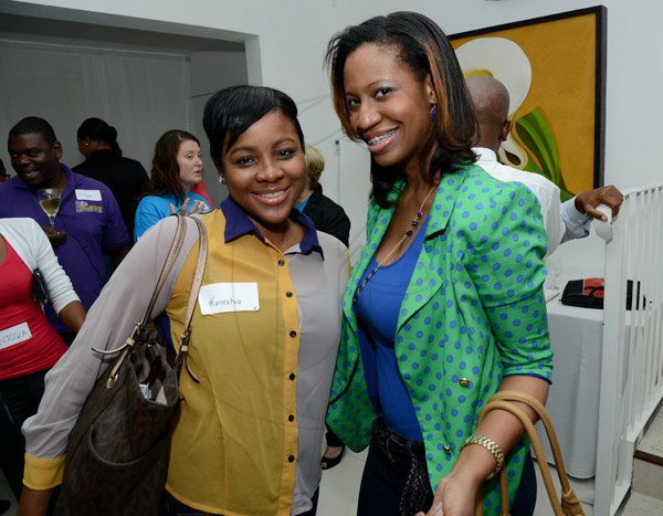 Rudolph Brown/Photographer
Kareen Cox, (right) Public Relations Officer of PSOJ pose with Keneshia Nooks, Corporate Communications Manager of Jamaica Business Development at the Wealth Magazine corporate mingle at the Spanish Court Hotel in New Kingston on Friday, January 31, 2014