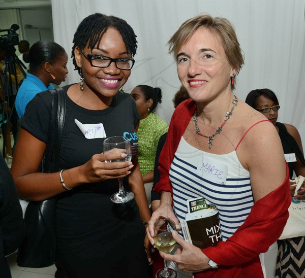 Rudolph Brown/Photographer
Marie Legault, (right)  Counsellor and Head of Cooperation - CIDA, Canadian High Commission pose with Mary Ifill at the Wealth Magazine corporate mingle at the Spanish Court Hotel in New Kingston on Friday,January 31, 2014