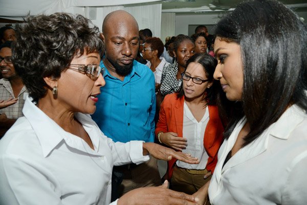 Rudolph Brown/Photographer
Business Desk
Lisa Hanna, (right) Minister of Youth and Culture chat with from left Angela Catnott, Realtor of Century 21, Garth Walker, Chairman of Creative Media and Events and Tina Matalon director of marketing, Restaurants of Jamaica at the Wealth Magazine corporate mingle at the Spanish Court Hotel in New Kingston on Friday,January 31, 2014