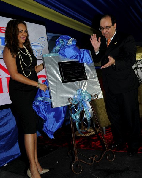 Winston Sill / Freelance Photographer
Prime Minister Portia Simpson-Miller attends the Official Opening and  Grand Unveiling Ceremony of Courts Store, held at Constant Spring Road on Friday evening December 7, 2012. Here are Samantha Singh (left); and Mario Siman (right), Group CEO, Unicomer.