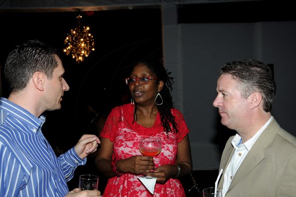 Winston Sill / Freelance Photographer
Digicel Jamaica host reception for House of Lords  and Commons Cricket Team, held at the East Lanws, Devon House, Hope Road on Saturday night February 16, 2013. Here rae Jason Corrigan (left); Mayor Angela Brown-Burke (centre); and Andy Thorburn (right).