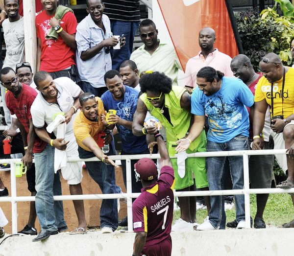 Ricardo Makyn/Staff Photographer Marlon Samuels greets Chris Gayle shortly after the end of the fifth ODI against the West Indies vs India at Sabina Park on Thursday 16.6.2011