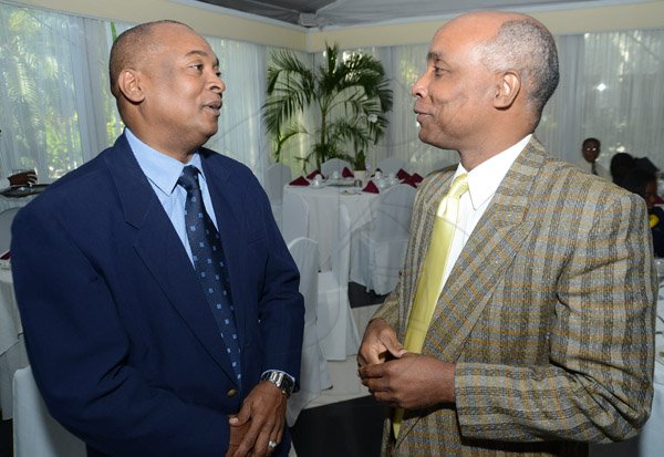 Rudolph Brown/ Photographer
Christopher Samuda chat with Ornel Bedasse at the Centralized Strategic Services(CSS) seminar "driving efficiencies through shared services" at the Terra Nova Hotel in Kingston on Wednesday, May 15, 2013