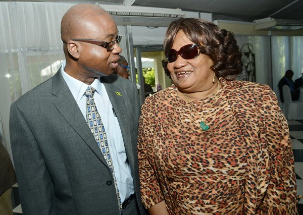 Rudolph Brown/ Photographer
Glenworth Francis, general manager of JCCUL chat with Dr Dorothy Raymond of Jamaica Teachers' Association Co-operative Credit Union at the Centralized Strategic Services (CSS) seminar "driving efficiencies through shared services" at the Terra Nova Hotel in Kingston on Wednesday, May 15, 2013