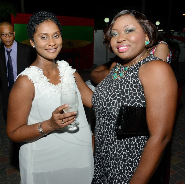Rudolph Brown/Photographer
Audrey Tulloch, (left) and Shona Hastings at the Credit Union Fund management Company Christmas party at the Spanish Court Hotel in New Kingston on Friday, December 13, 2013