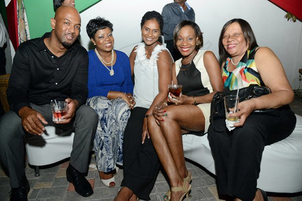 Rudolph Brown/Photographer
Adrian Thompson, CEO of Credit Union Fund Management pose with right Joan Garfield, of NCB Credit Union, Patricia Fagan, First Global Bank Branch Manager, Audrey Tulloch and Georgia Morrison at the Credit Union Fund management Company Christmas party at the Spanish Court Hotel in New Kingston on Friday, December 13, 2013