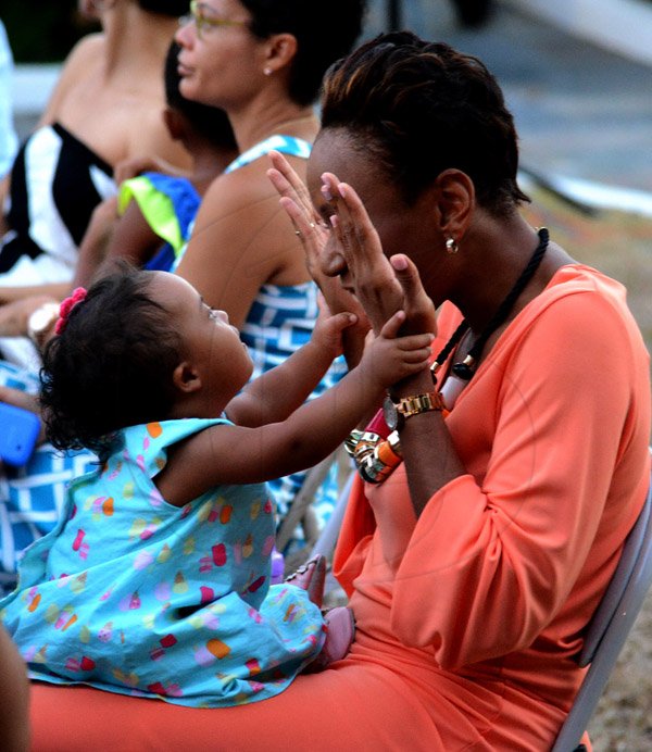 Winston Sill/Freelance Photographer
The Canadian Women's Club of Jamaica (CWC) presents their annual Spring Fashion Show dubbed "Spring Into Fashion", a focus on Jamaican Fashions, held at Seymour Avenue on Sunday May 4, 2014. Here are Rochelle Cameron, Head of Legal and Regulatory Affairs, LIME, and her god-daughter Noa Moss-Solomon.
