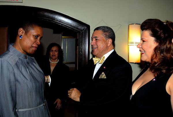 Winston Sill / Freelance Photographer
Dr. Jose Tomas Ares German, ambassador of the Dominican Republic and wife Sheila Stefan de Ares host reception to celebrate the 168th Anniversary of Independence of Dominican Republic, held at the Jamaica Pegasus Hotel, New Kingston on Monday night February 27, 2012. Here are Dr. Iva Gloudon (left). Trinidad and Tobago High Commissioner;  Ambassador German (centre); and Sheila de Ares (right).