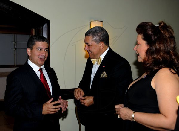 Winston Sill / Freelance Photographer
Dr. Jose Tomas Ares German, ambassador of the Dominican Republic and wife Sheila Stefan de Ares host reception to celebrate the 168th Anniversary of Independence of Dominican Republic, held at the Jamaica Pegasus Hotel, New Kingston on Monday night February 27, 2012. Here are Dennis Valdez (left),Managing Director, Newport-Fersan, Jamaica; Ambassador German (centre); and Sheila de Ares (right).