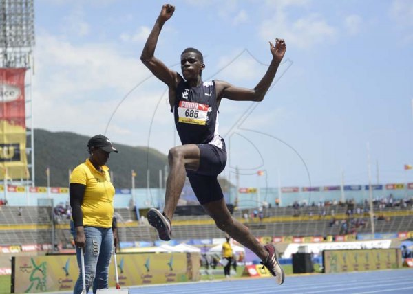 Shorn Hector/Photographer Michael Curriah of Jamaica College competing in the boys class three long jump on day four of the ISSA/GraceKennedy Boys and Girls’ Athletics Championships held at the The National Stadium in Kingston on Friday March 29, 2019