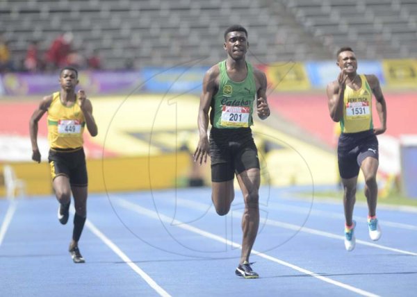 Shorn Hector/Photographer Evaldo Whitehorne of Calabar  (center) wins heat one of the boys class one 400 meter semi-final on day four of the ISSA/GraceKennedy Boys and Girls’ Athletics Championships held at the The National Stadium in Kingston on Friday March 29, 2019